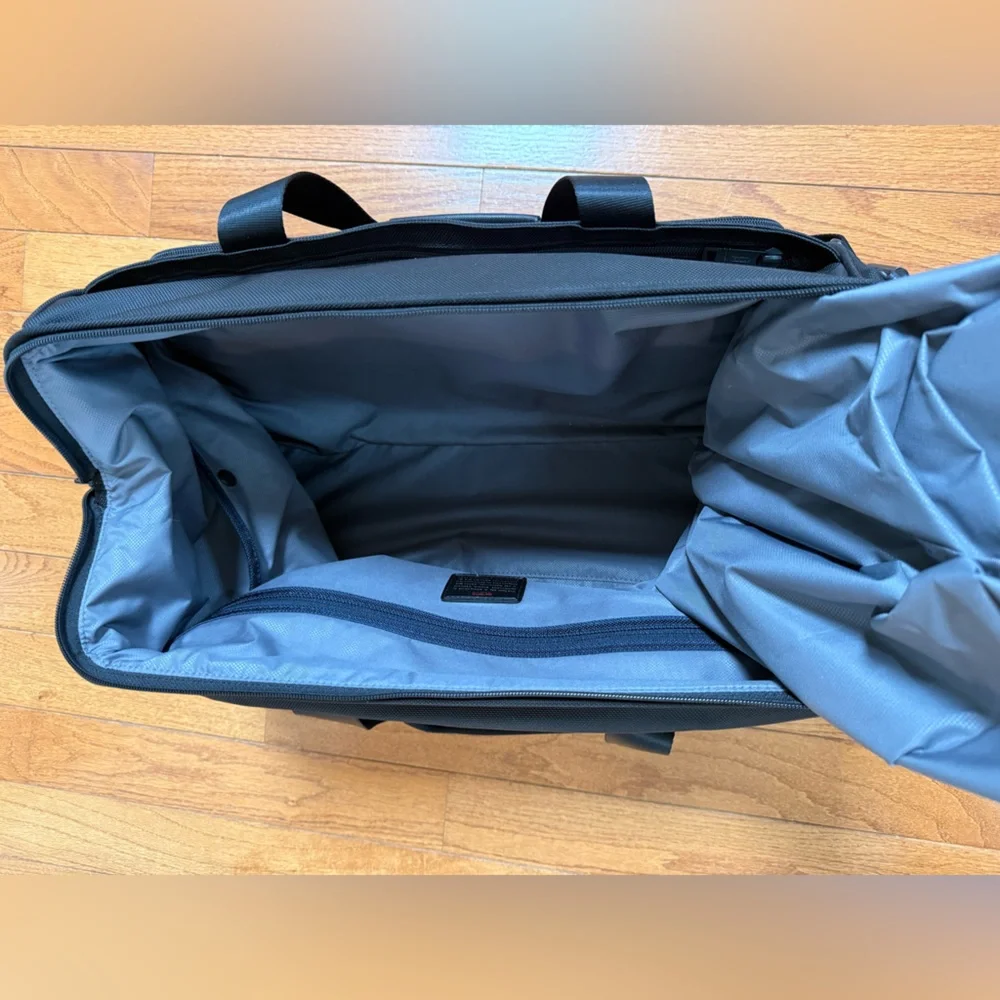 Tumi Black Duffel Bag with Adjustable Shoulder Strap